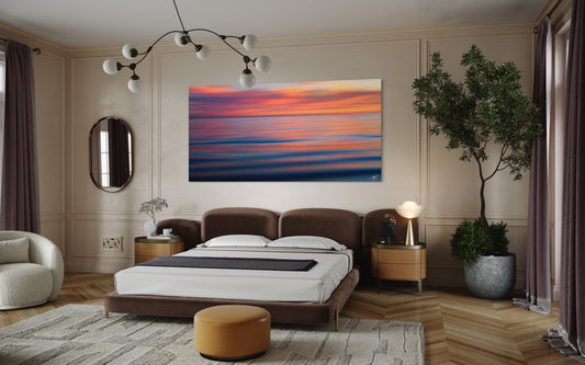 A serene long-exposure ocean abstract reflecting soft sunset colors across rippling water. A minimalist fine art seascape perfect for modern coastal interiors.