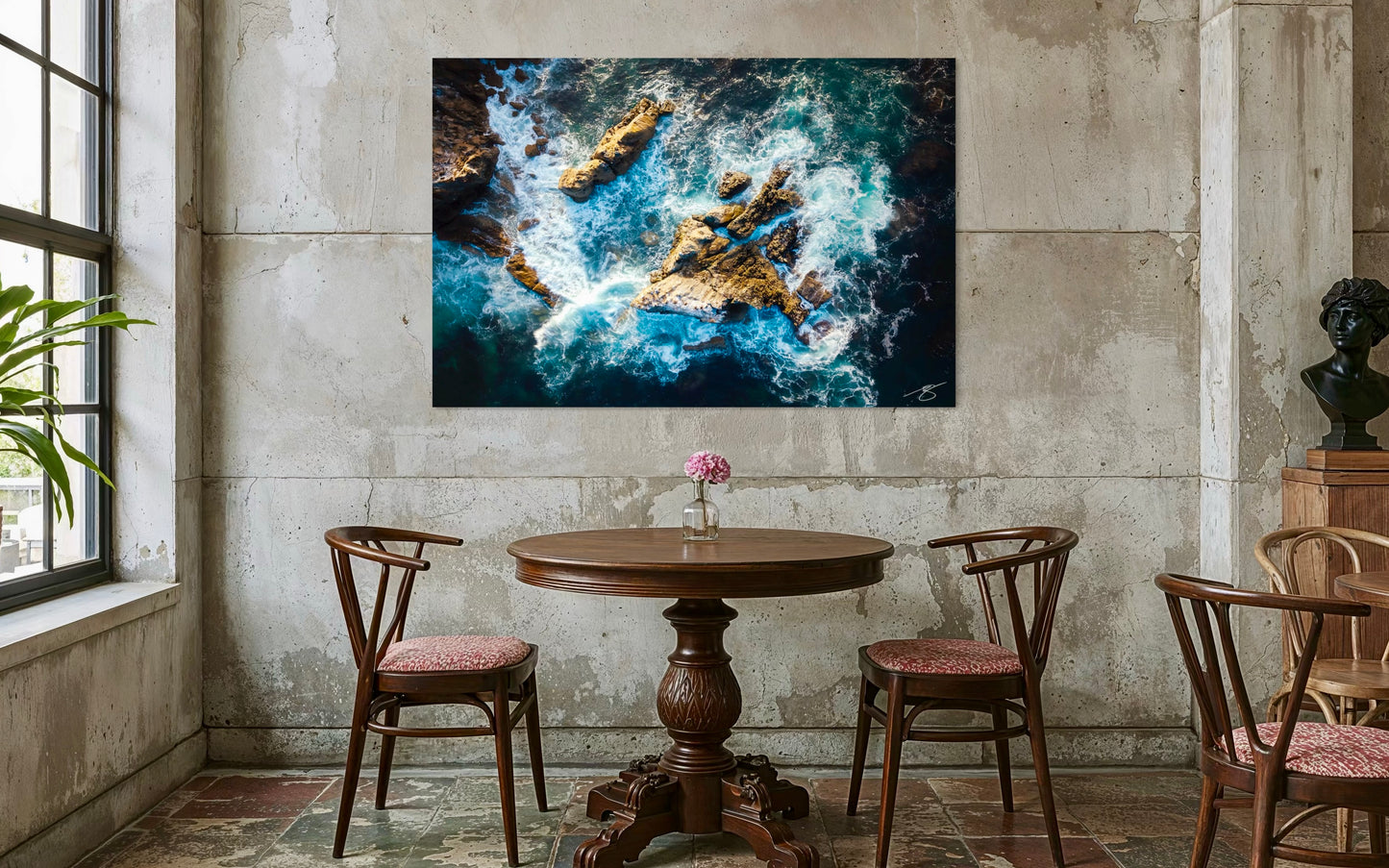 Room interior with a large abstract painting on the wall, wooden table, and chairs.