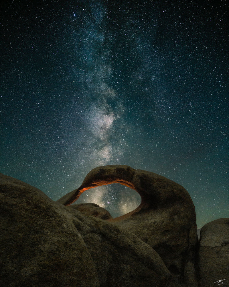 Milky Way shining above Mobius Arch in Alabama Hills, fine art night sky photograph by Beau Jesse Johnston.