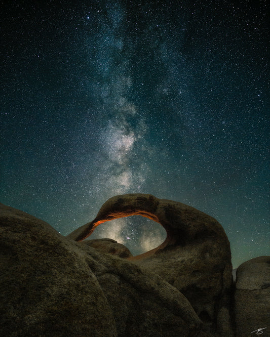 Milky Way shining above Mobius Arch in Alabama Hills, fine art night sky photograph by Beau Jesse Johnston.