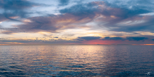 Calm ocean horizon under pastel sunset sky, fine art seascape photography by Beau Jesse Johnston.