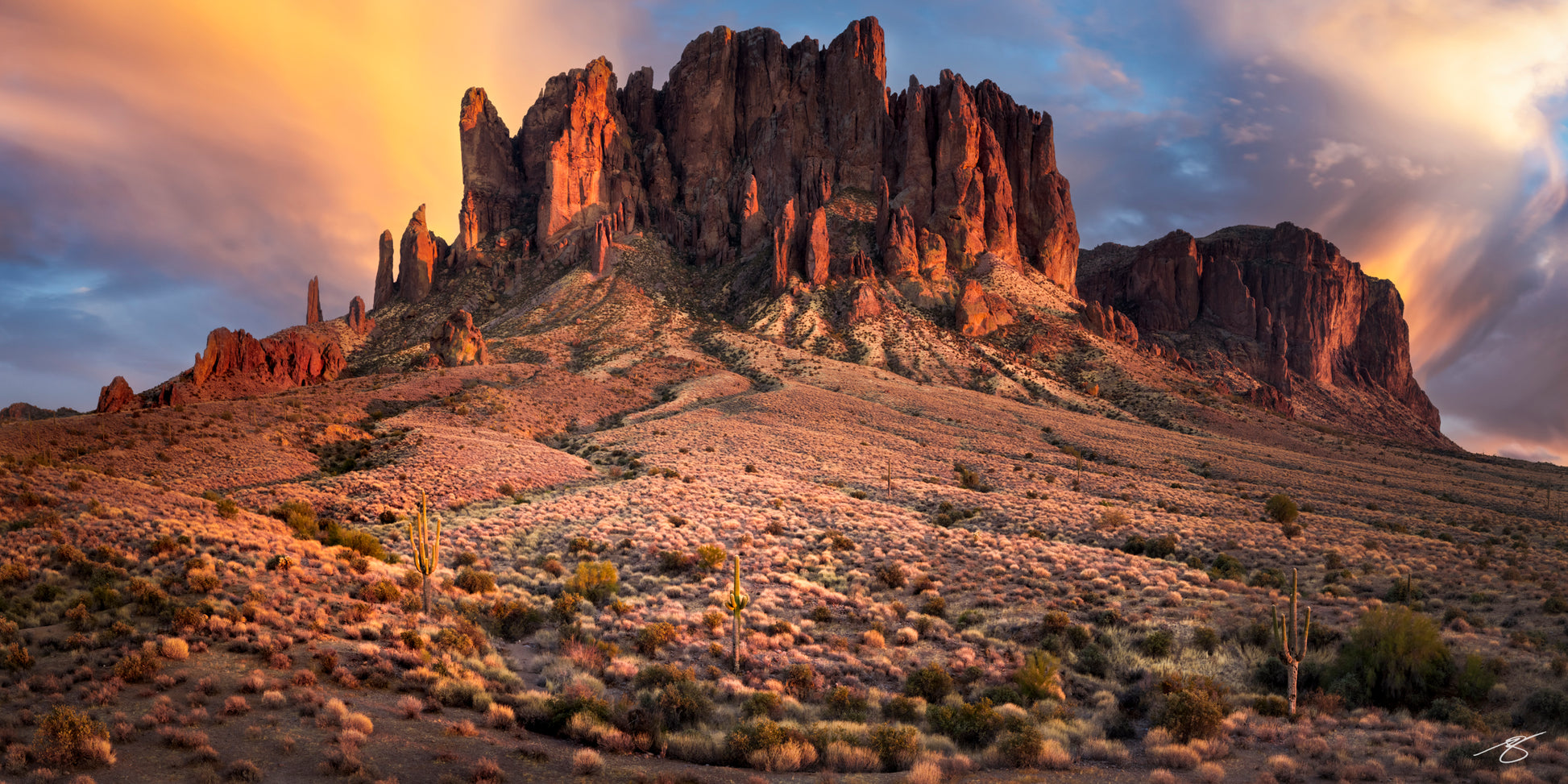 Superstition Mountains glowing at sunset in Arizona desert, fine art landscape photography by Beau Jesse Johnston.