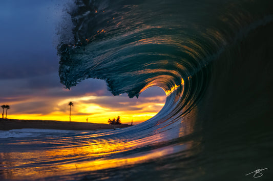 Breaking ocean wave glowing at sunset in California, fine art surf photography by Beau Jesse Johnston.