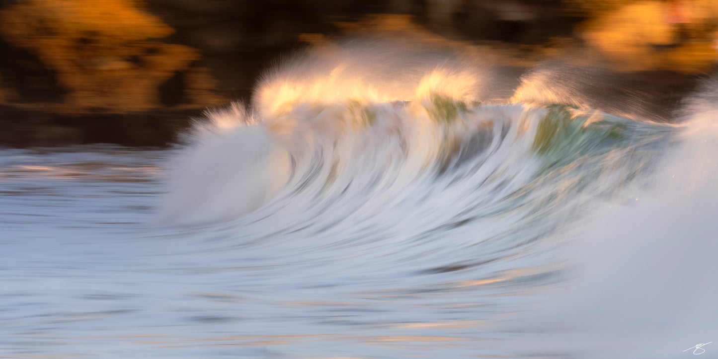 Golden abstract wave in motion at sunset, fine art ocean photography print by Beau Jesse Johnston.