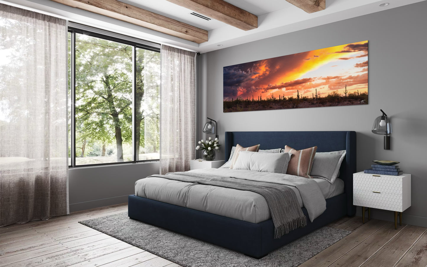 Modern bedroom with a large bed, nightstands, and a sunset wall art.