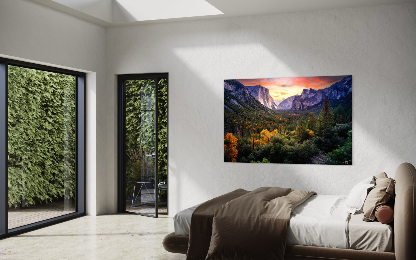 Sunset view of Yosemite Valley with autumn foliage, El Capitan, Half Dome, and glowing sky above a forested landscape.