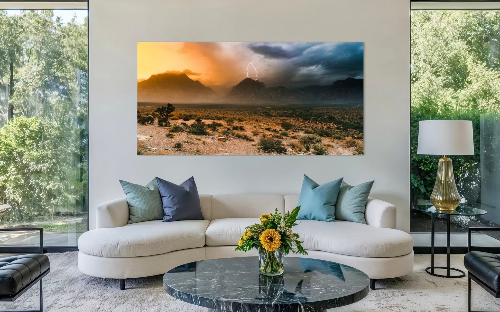 Modern living room with a large desert landscape painting on the wall.