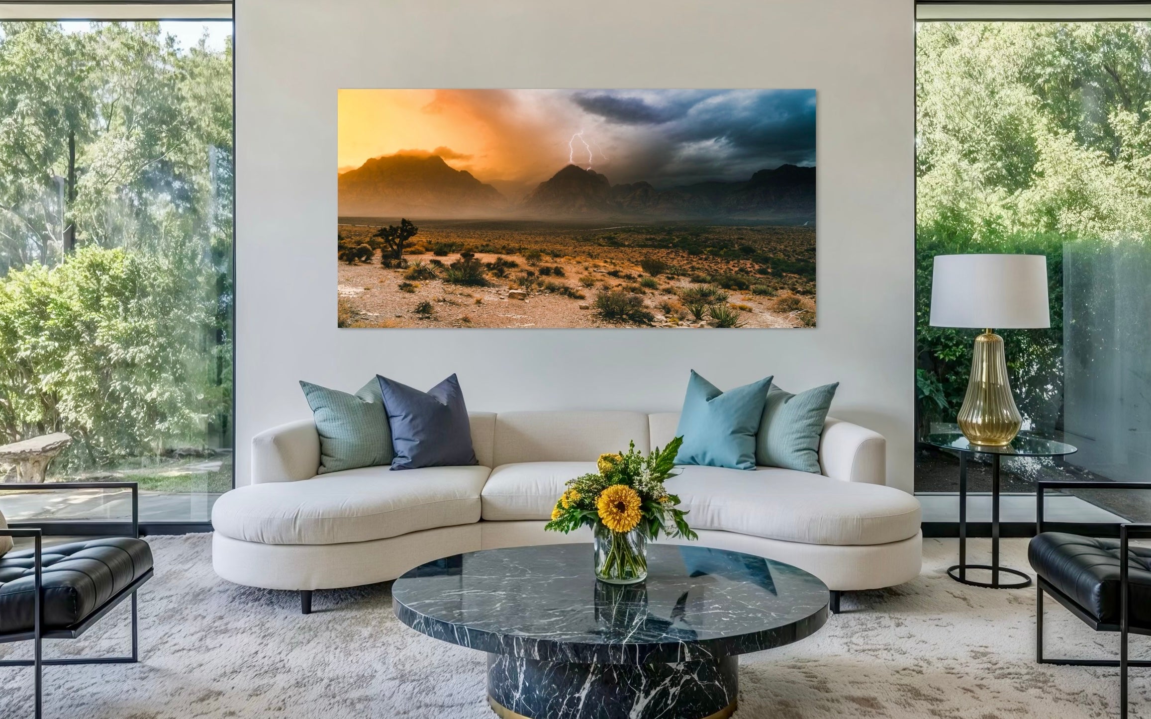 Modern living room with a large desert landscape painting on the wall.