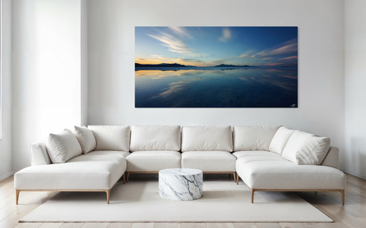 A serene long-exposure sunset over the Bonneville Salt Flats, where pastel skies reflect across shallow water. A peaceful fine art landscape from Utah’s desert.