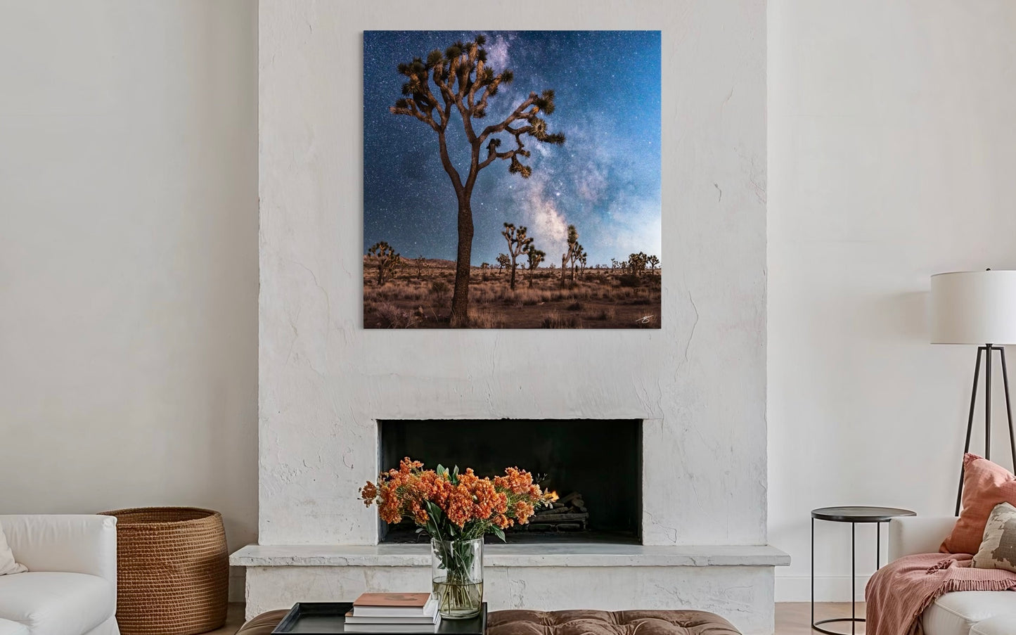 Lobby with a large wall art of Joshua trees and night sky, white walls, and modern decor.