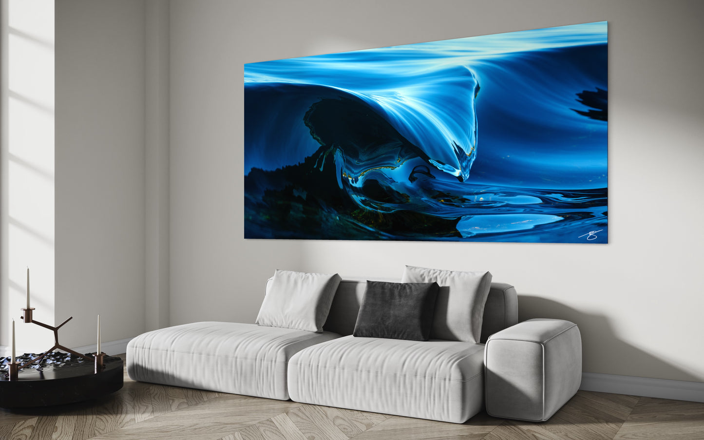 Abstract cresting wave in deep blue tones, capturing smooth liquid motion and sculptural ocean texture in a close-up fine-art photograph.