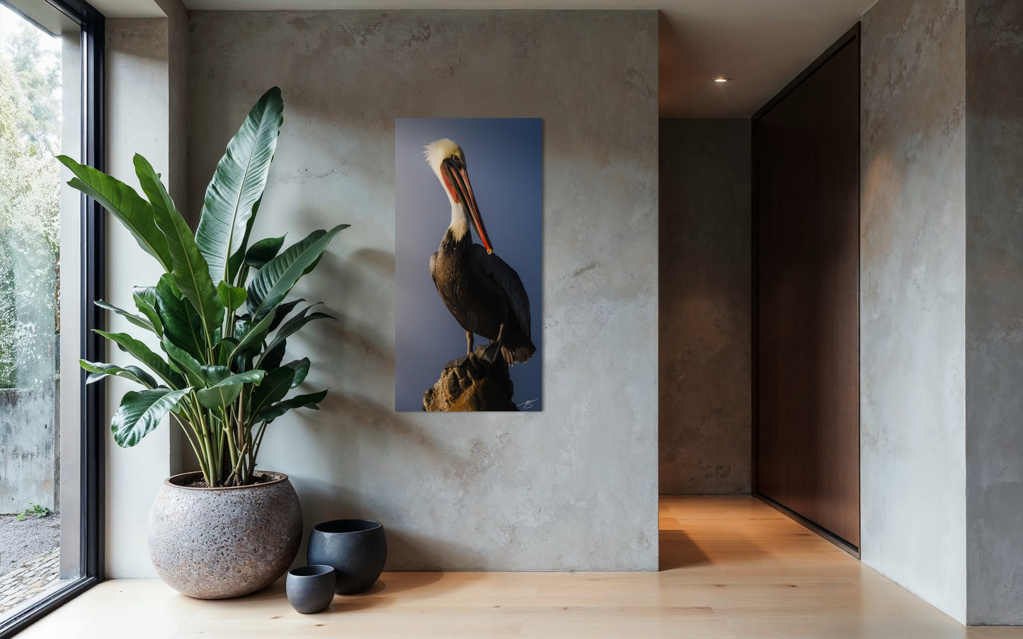 Modern interior with a plant and a wall-mounted artwork of a pelican.