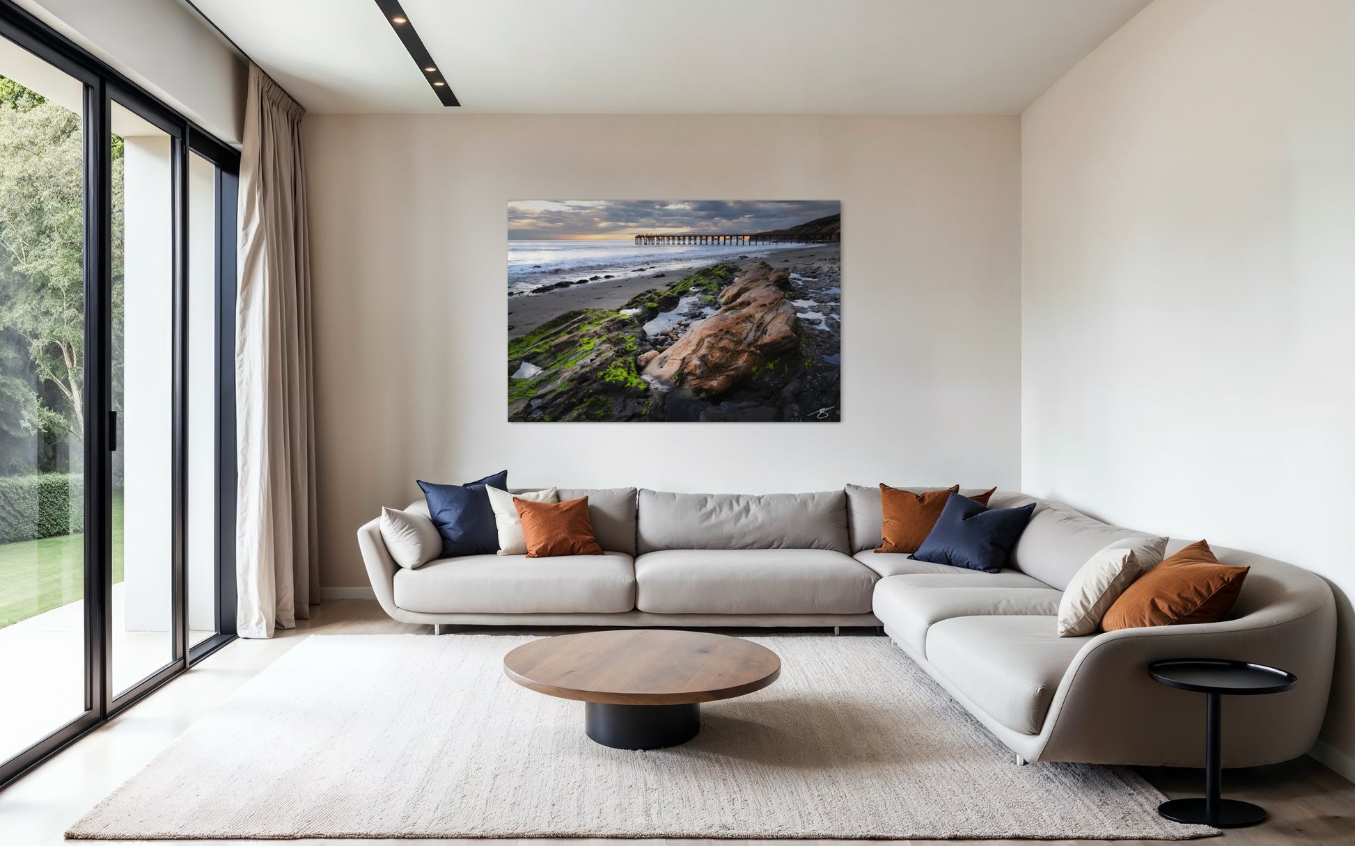 Modern living room with a sectional sofa, coffee table, and wall art.