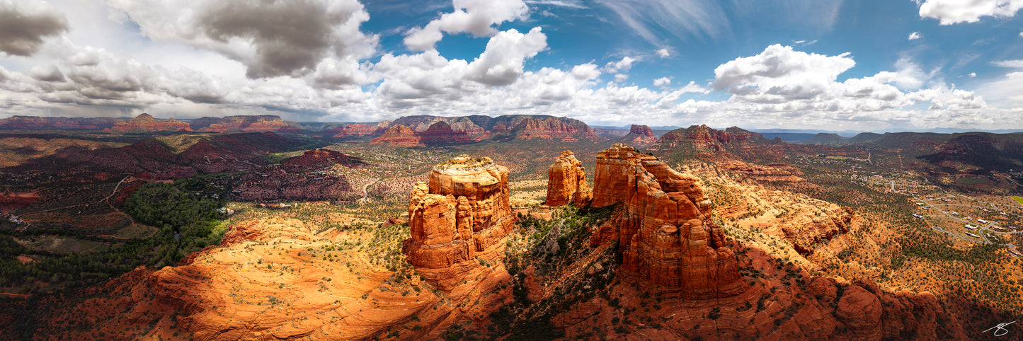Panoramic fine art landscape of Sedona’s Cathedral Rock and red desert under dramatic clouds by Beau Jesse Johnston.