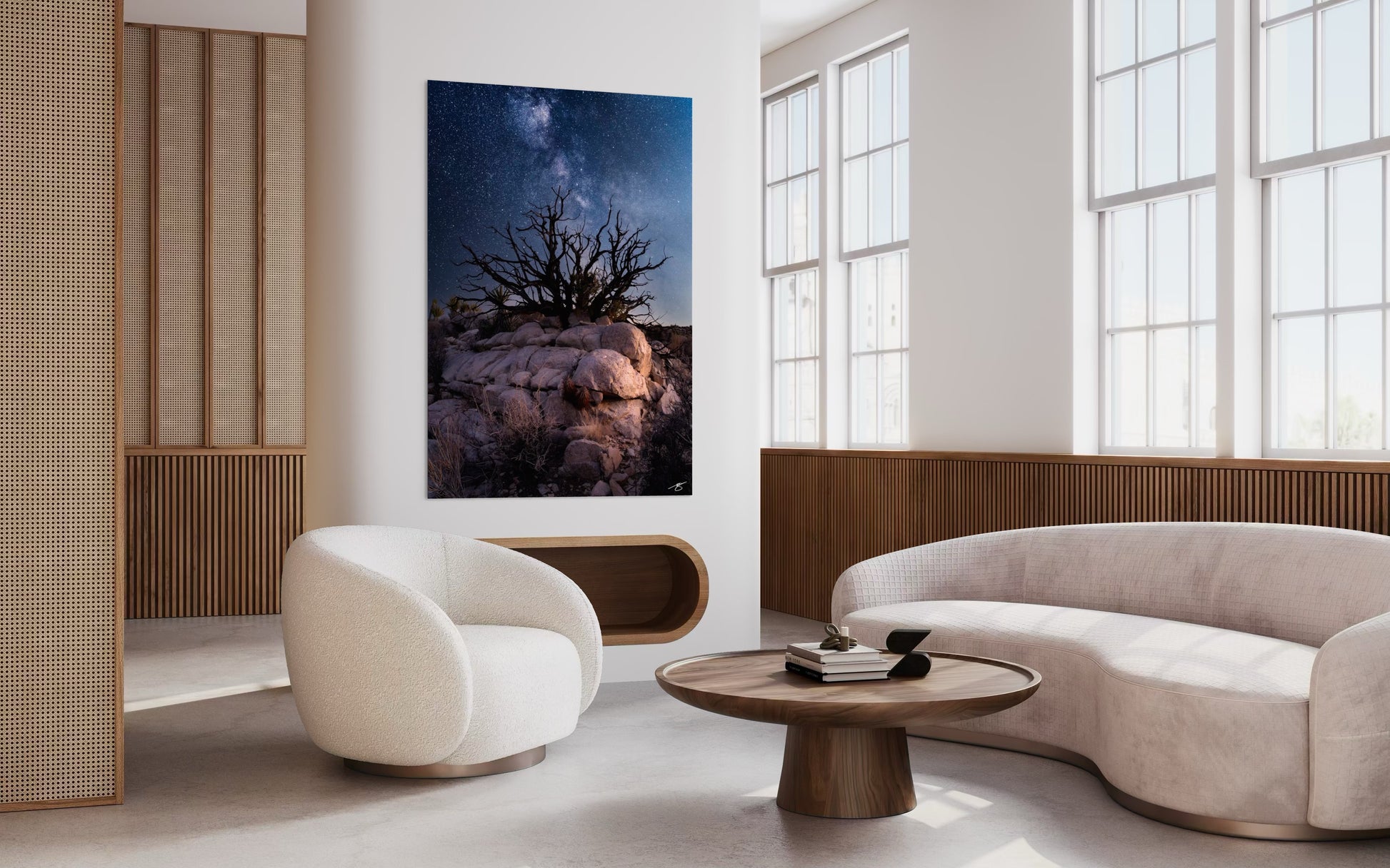 Modern living room with a large wall art piece of a tree and sky.