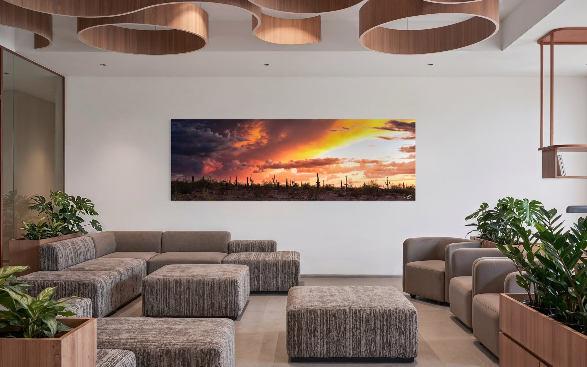 Monsoon Divide fine art photograph displayed in a modern living room featuring dramatic Arizona monsoon clouds and sunset light over the Sonoran Desert