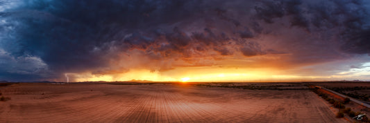 Lightning striking beneath a monsoon sunset in the Arizona desert — fine art landscape photograph by Beau Jesse Johnston.
