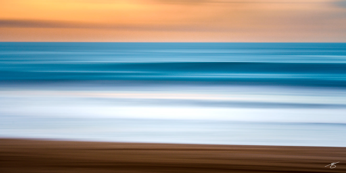 Quiet Current abstract ocean photography featuring soft blue waves, warm coastal light, and intentional camera movement along the California coastline
