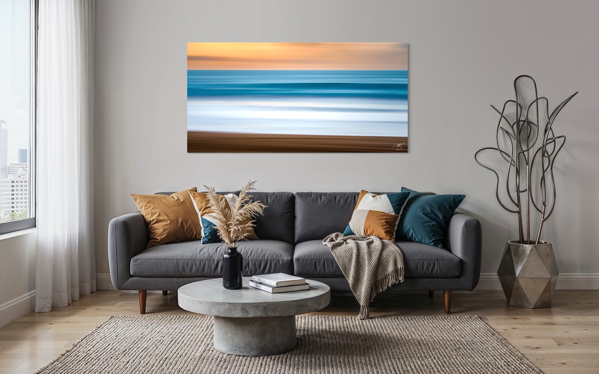 Modern coastal living room featuring Quiet Current abstract ocean wall art by Beau Jesse Johnston displayed above a sofa