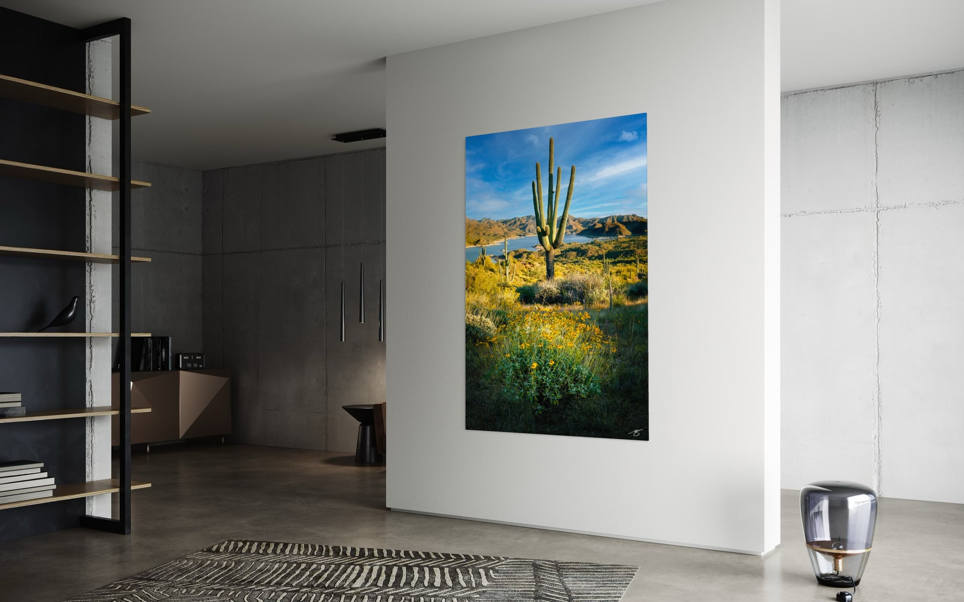 Modern interior with a large wall art of a desert landscape featuring a cactus.