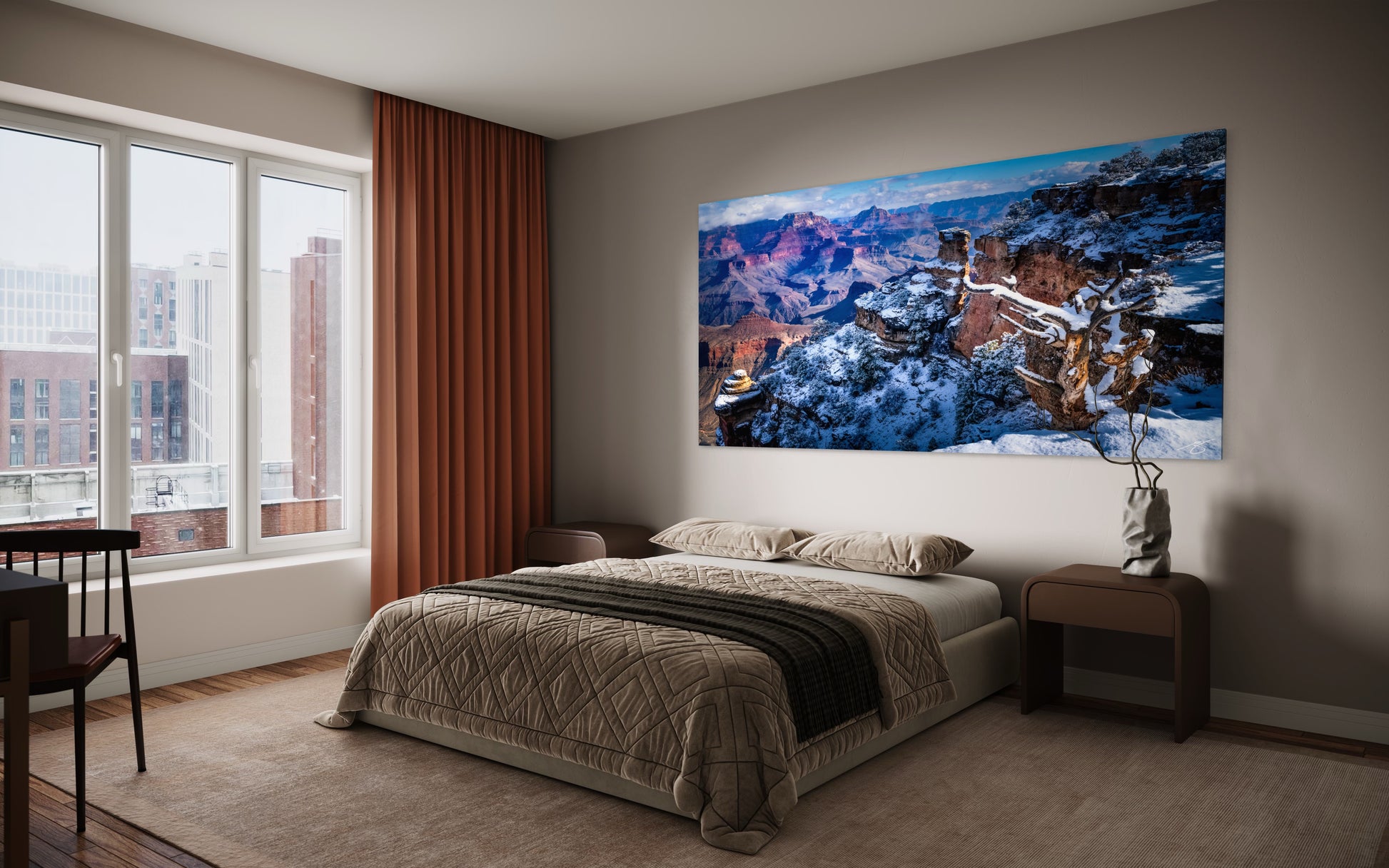 Snow-covered South Rim of the Grand Canyon at sunrise, with glowing canyon walls and dramatic winter landscape in a panoramic view.