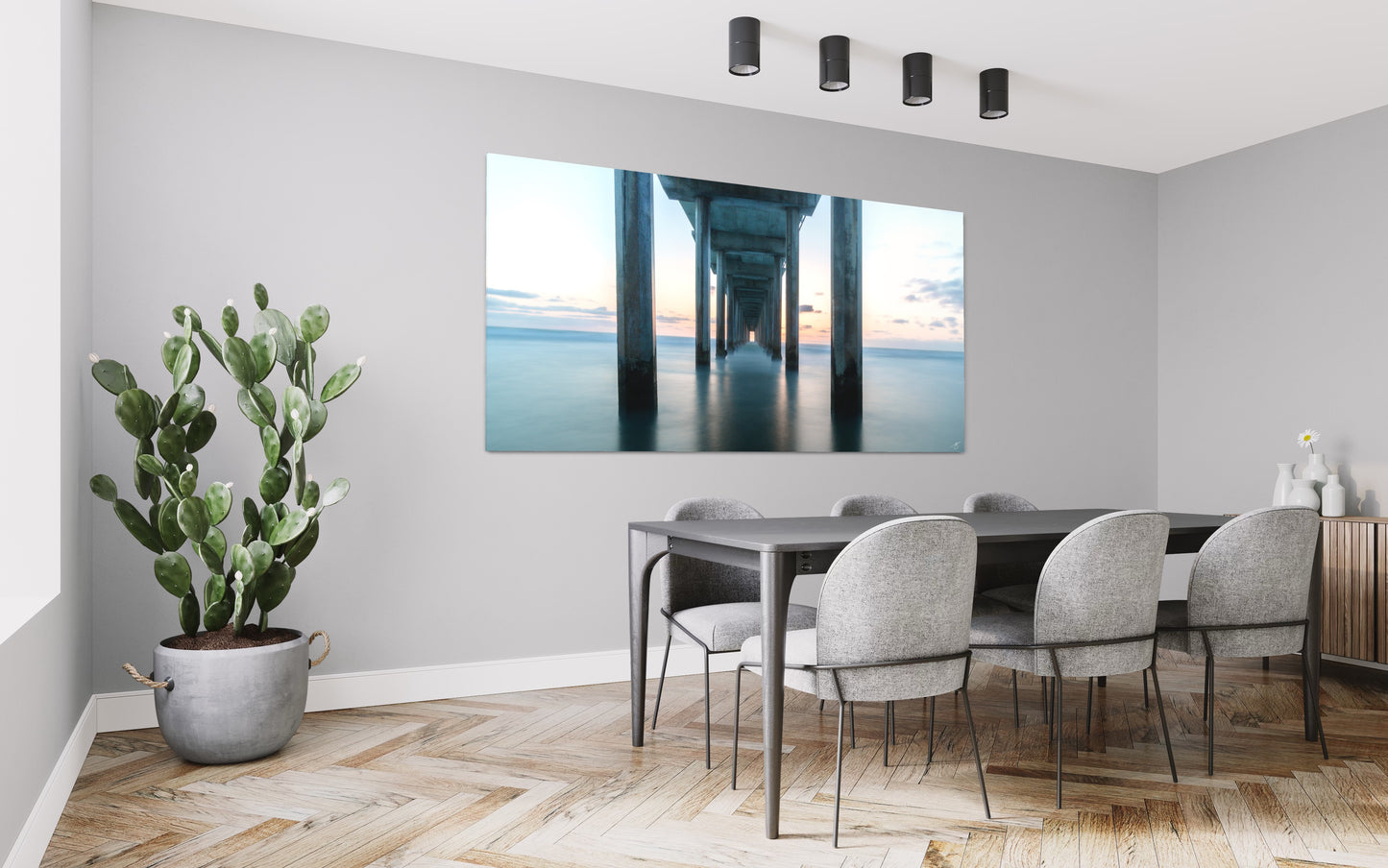 Soft sunset light beneath Scripps Pier creates a tranquil, minimalist ocean scene. A fine art coastal print featuring symmetry, calm water, and peaceful hues.