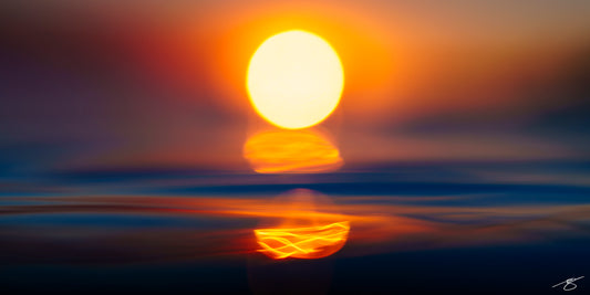 Abstract photo of the sun over the ocean at sunset with a glowing reflection and soft blurred bands of blue water and orange sky