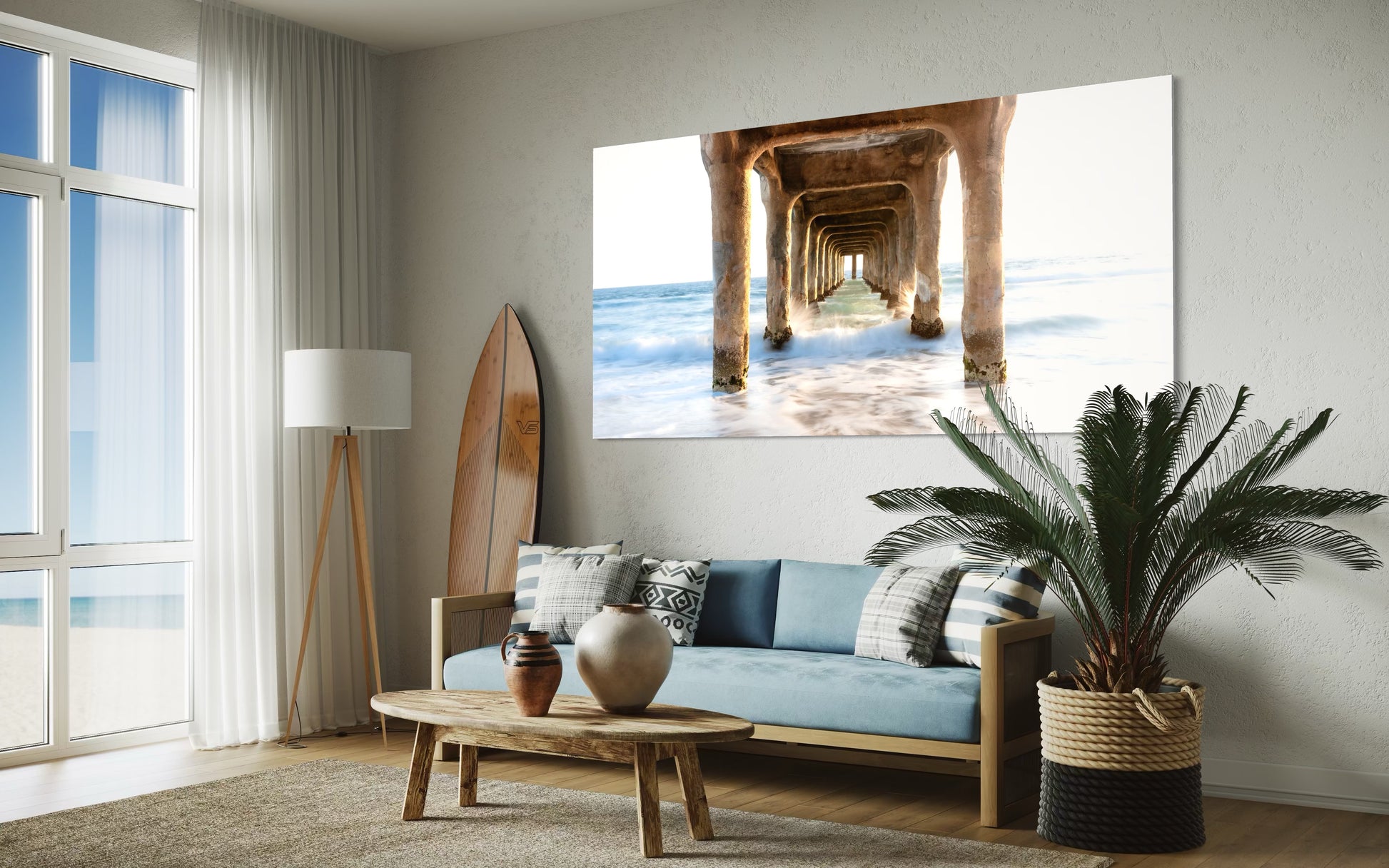 Living room with a large wall art of a beach scene with a pier.