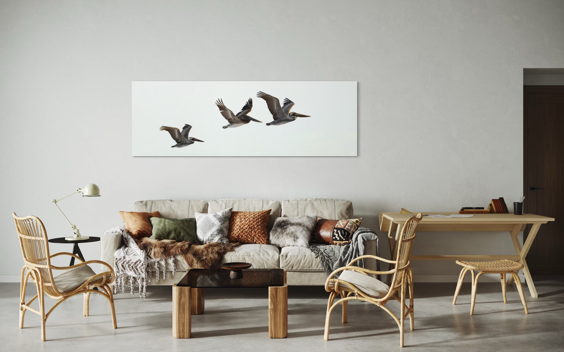 Living room with a sofa, chairs, and a wall art of birds.