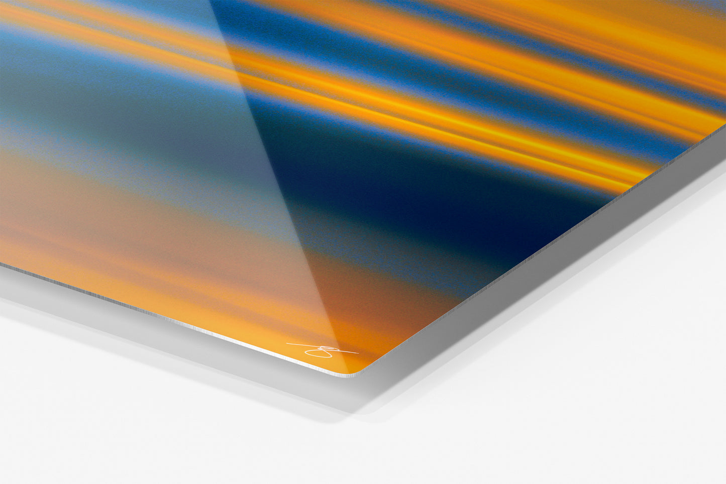 Close-up detail of the Molten Horizon aluminum print showing the glossy archival metal finish and rounded corner