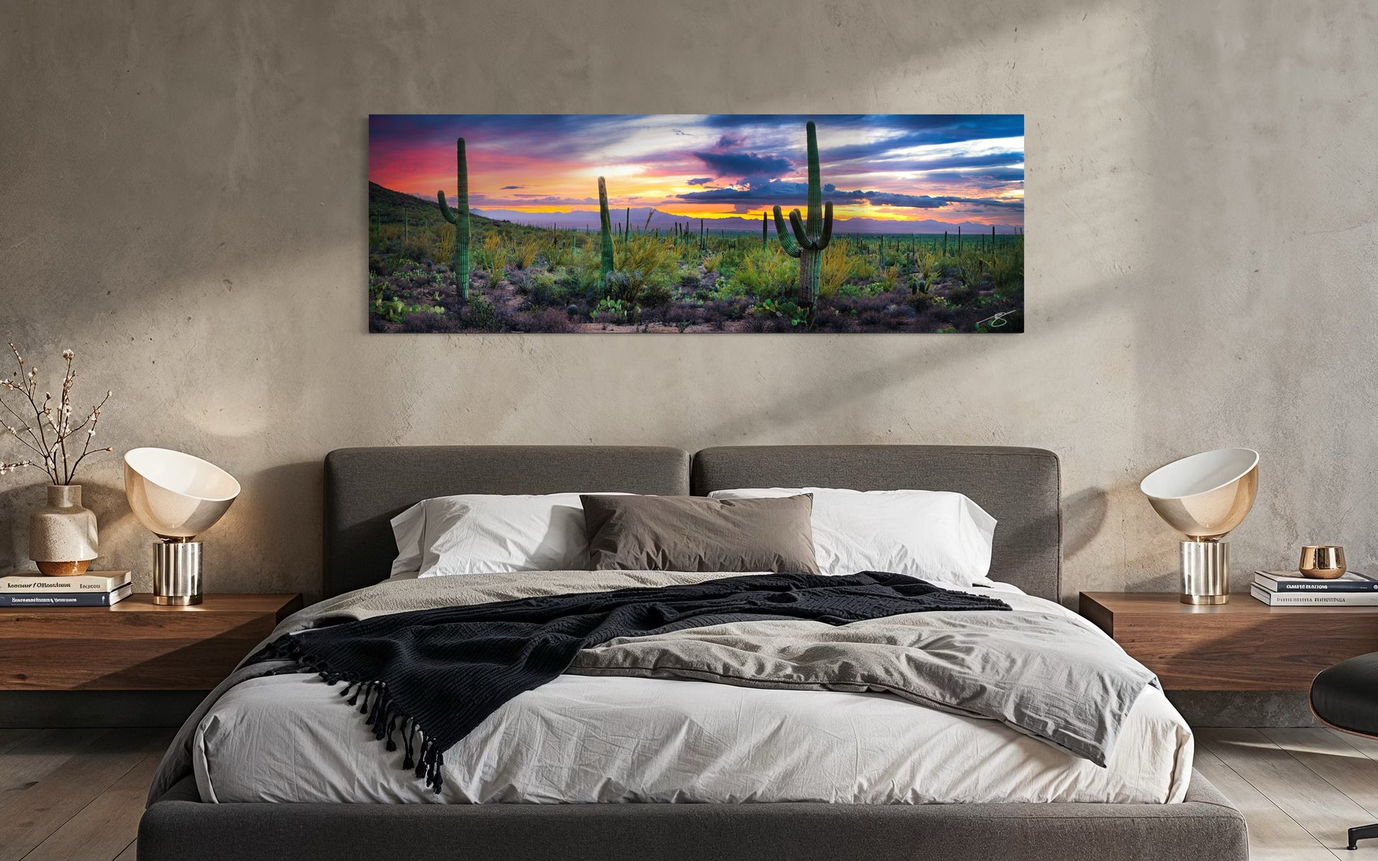 Large panoramic Sonoran Desert photography print displayed above a bed in a modern bedroom
