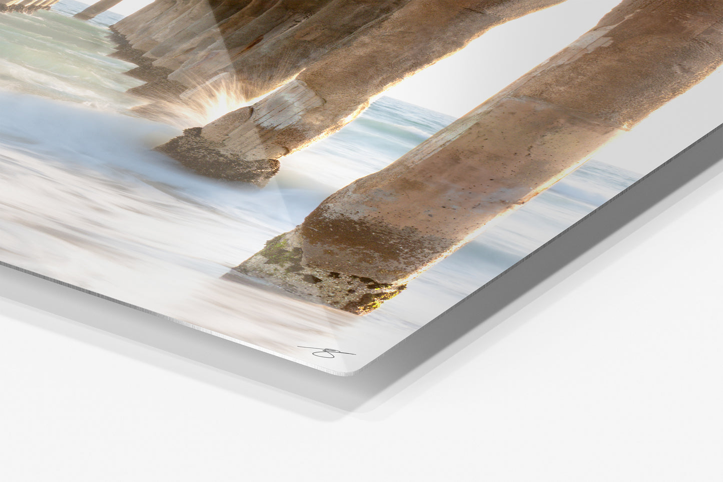 Close-up detail of the Tidal Passage aluminum print showing the glossy archival metal finish and rounded corner
